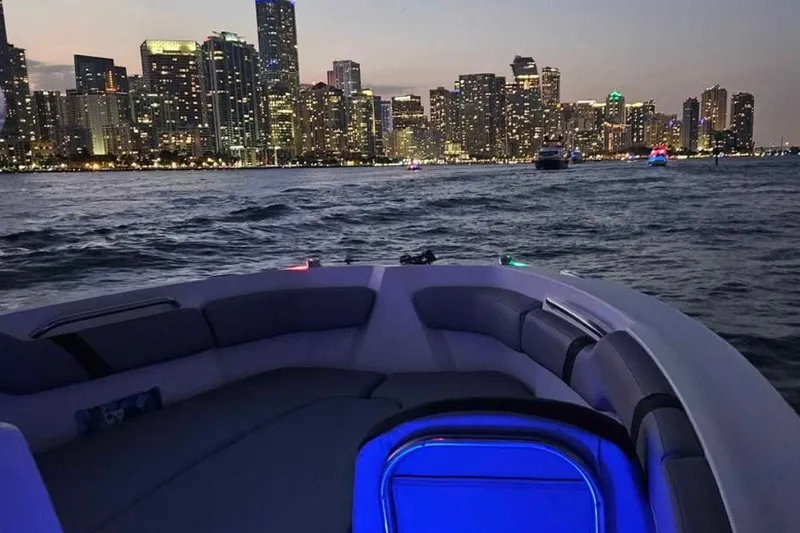 Slide: The Image of 2020 Striper 220 Center Console boat with city skyline at dusk. - 70