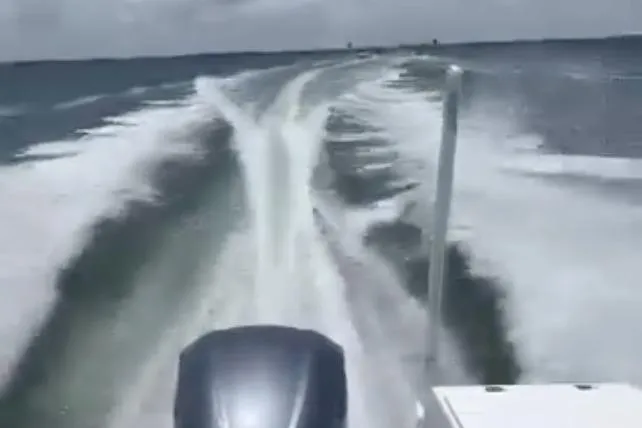 Slide: The Image of Striper 220 Center Console boat creating a wake on open water, 2020 model. - 72