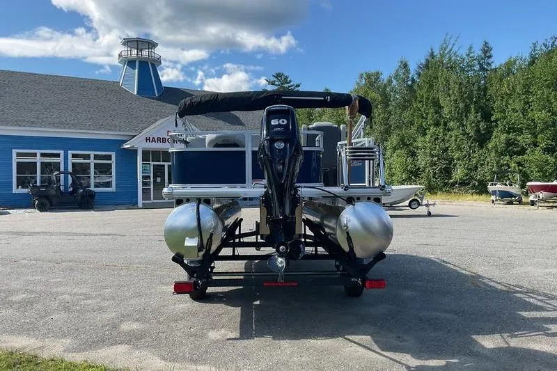 Slide: The Image of 2026 Sun Tracker BB 18 DLX pontoon boat with 60 HP engine at a marina. - 7