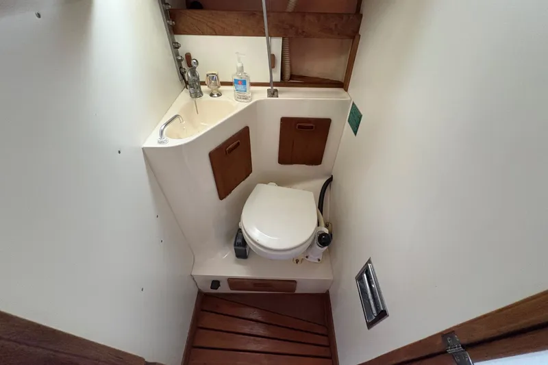Slide: The Image of Compact bathroom in 1981 Sabre 31 sailboat with toilet and sink. - 117