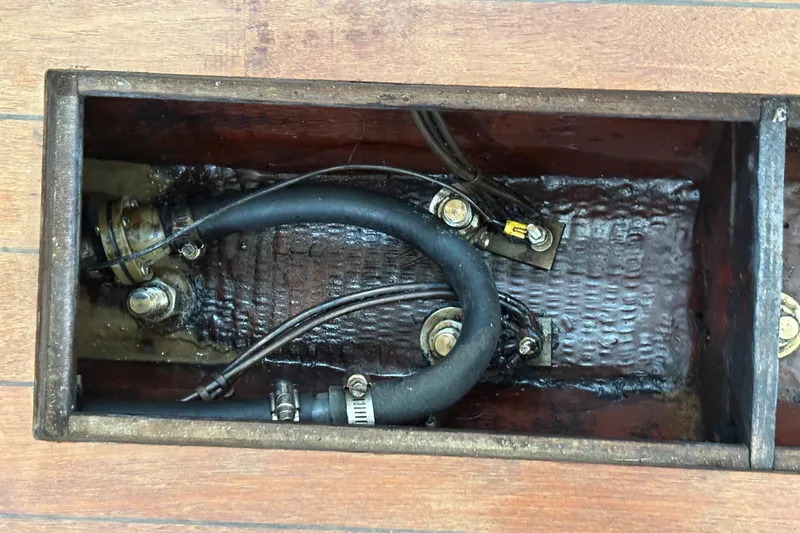 Slide: The Image of 1981 Sabre 31 boat bilge with hoses and wiring visible. - 138