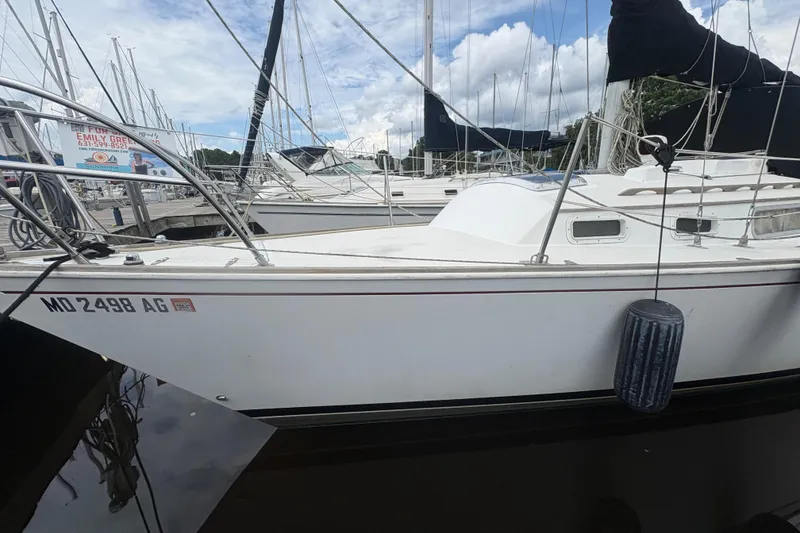 Slide: The Image of 1981 Sabre 31 sailboat docked at marina, cloudy sky background. - 33