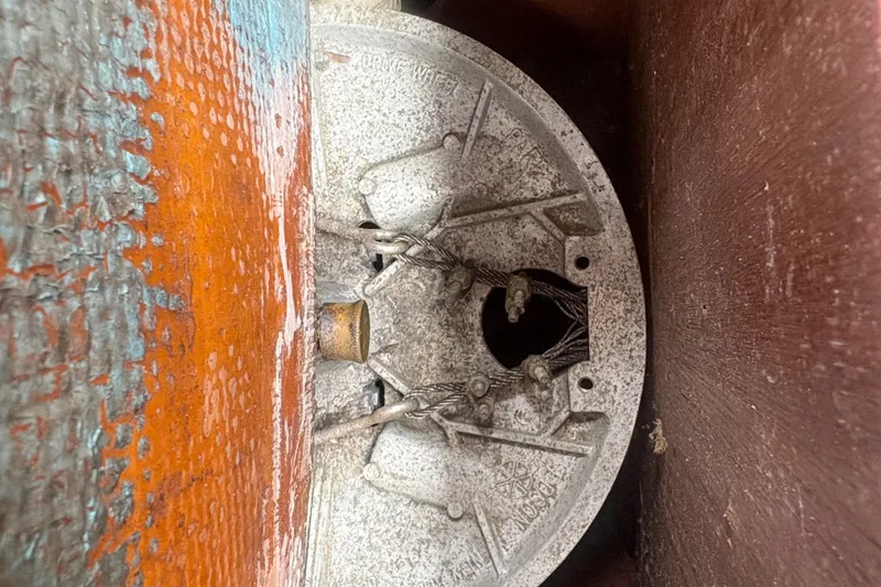 Slide: The Image of Close-up of a weathered Sabre 31 boat component, showcasing intricate details and textures. - 37