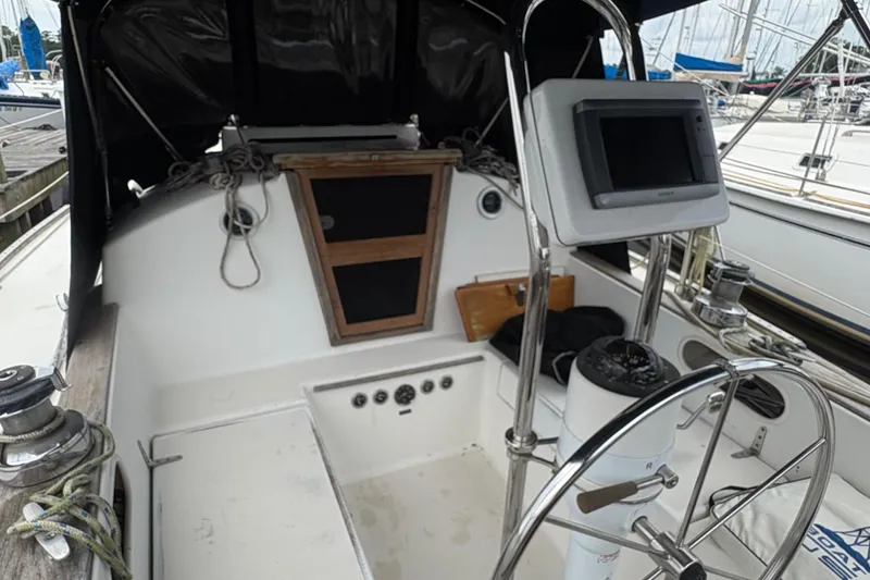 Slide: The Image of Cockpit of 1981 Sabre 31 sailboat with steering wheel and navigation equipment. - 40
