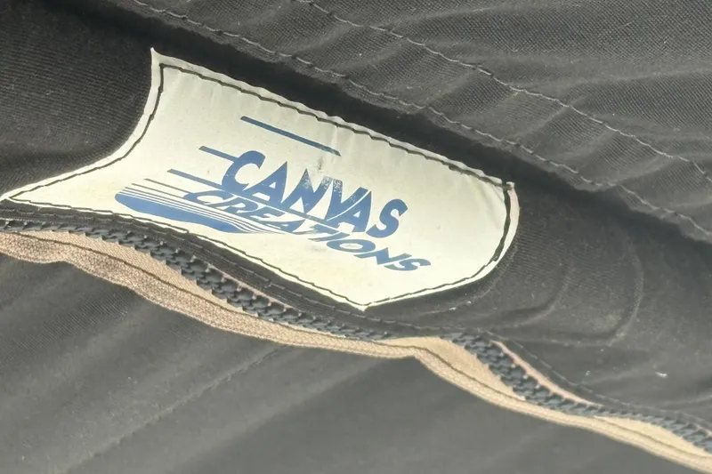 Slide: The Image of Canvas Creations label on black fabric, Sabre 31, 1981 model. - 44
