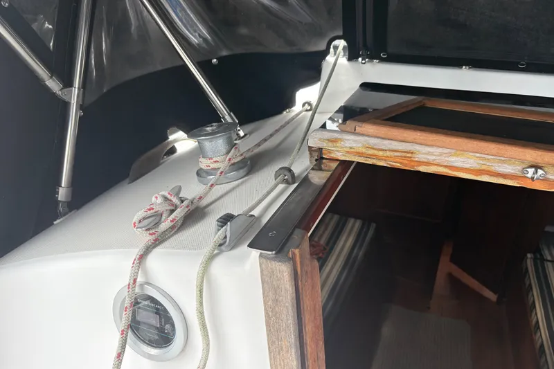 Slide: The Image of Interior view of a 1981 Sabre 31 sailboat with ropes and wooden hatch. - 53