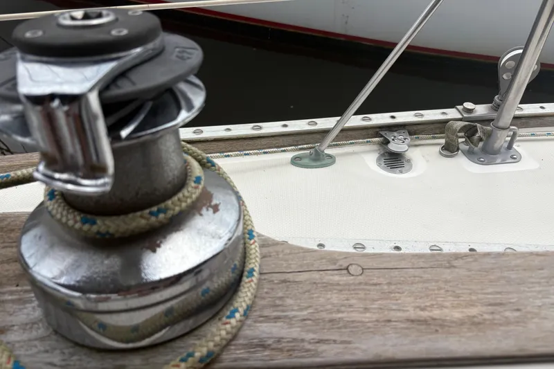 Slide: The Image of Close-up of a 1981 Sabre 31 sailboat deck with winch and rigging. - 69