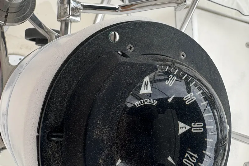 Slide: The Image of Compass on 1981 Sabre 31 sailboat, showing cardinal directions and degrees. - 73