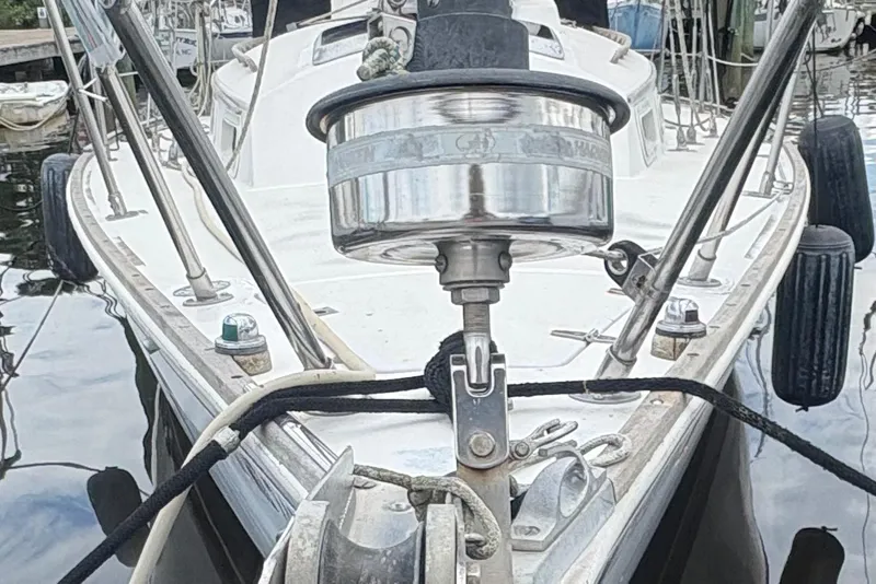 Slide: The Image of 1981 Sabre 31 sailboat cockpit with steering wheel, docked at marina. - 10