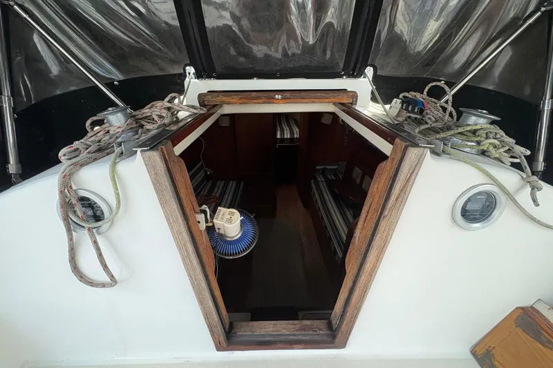 Slide: The Image of 1981 Sabre 31 sailboat docked at marina, showing deck and rigging details. - 14