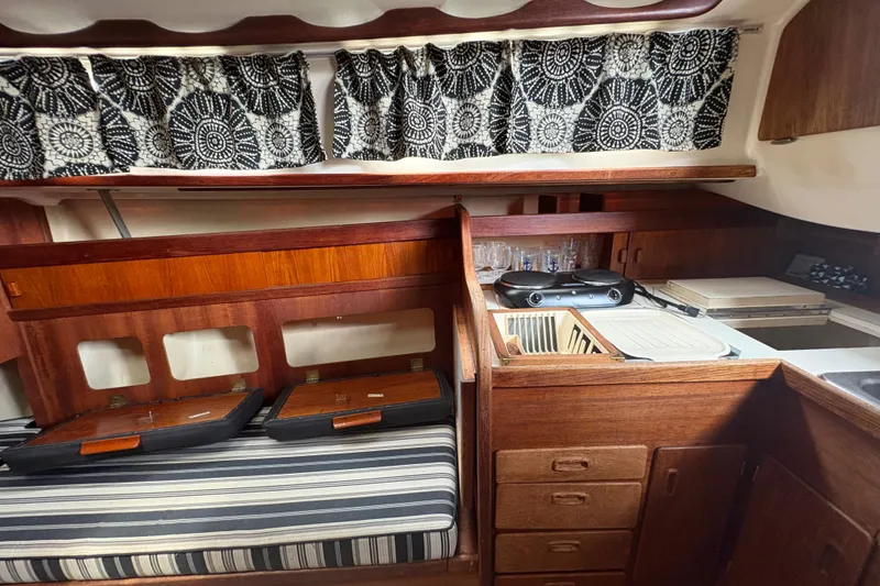 Slide: The Image of Cockpit of 1981 Sabre 31 sailboat with steering wheel and navigation equipment. - 17