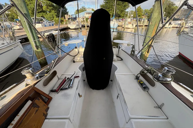 Slide: The Image of Interior cabin of 1981 Sabre 31 sailboat with striped cushions and wooden accents. - 25