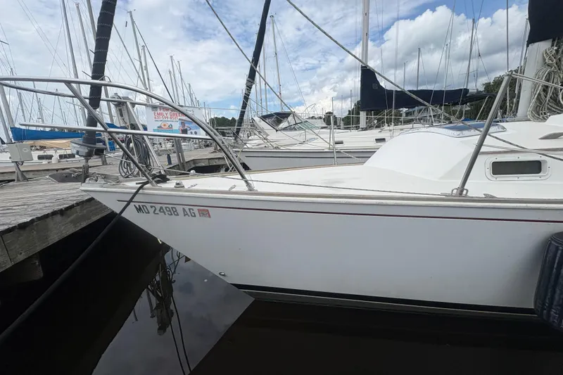 Slide: The Image of 1981 Sabre 31 yacht bathroom with sink, toilet, mirror, and window. - 32