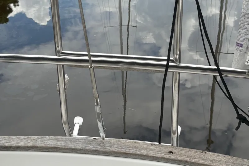 Slide: The Image of 1981 Sabre 31 yacht kitchen with stove, sink, and wooden cabinetry. - 52