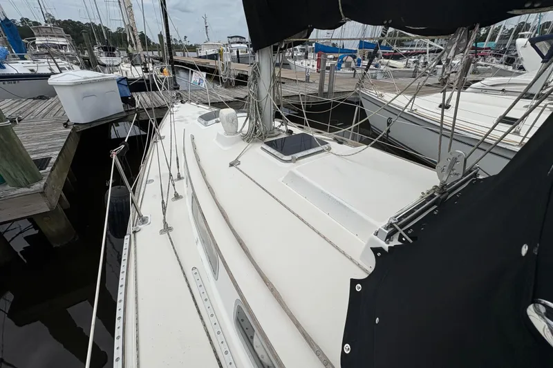Slide: The Image of Interior storage compartment of a 1981 Sabre 31 sailboat with wooden finish. - 58