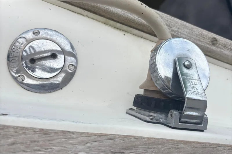 Slide: The Image of Wooden floor with open compartments on a 1981 Sabre 31 boat. - 75