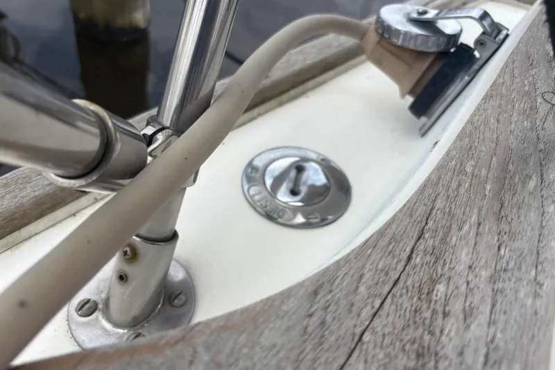 Slide: The Image of Engine compartment of a 1981 Sabre 31 sailboat showing hoses and fittings. - 76