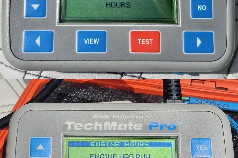 Slide: The Image of Digital diagnostic tool displaying engine hours for 2003 Sonic USA 31SS. - 100