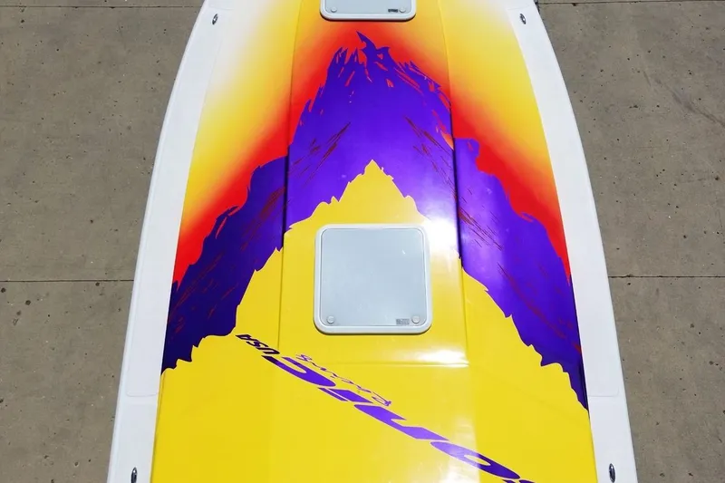 Slide: The Image of Colorful 2003 Sonic USA 31SS boat with vibrant purple and yellow mountain design. - 36