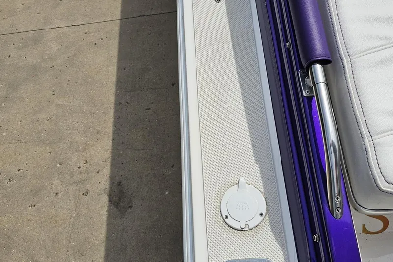 Slide: The Image of Close-up of 2003 Sonic USA 31SS boat deck with white and purple accents. - 43