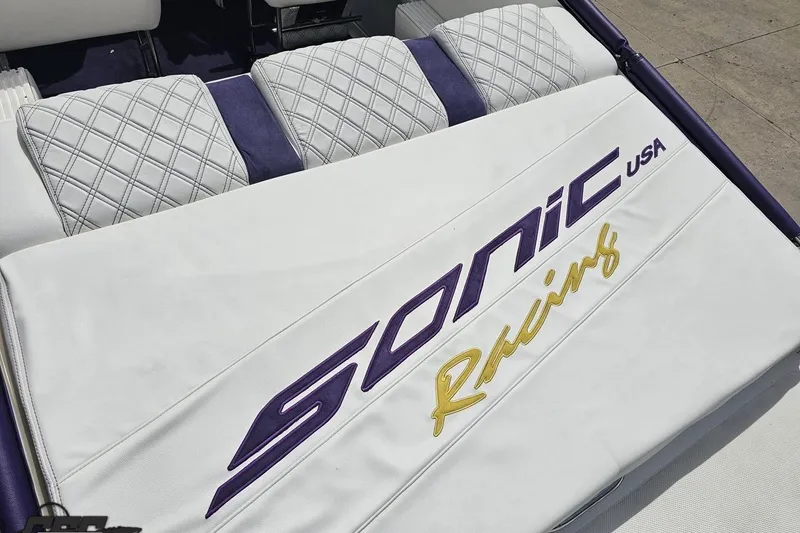 Slide: The Image of White and purple Sonic USA 31SS 2003 boat seat with quilted design and logo. - 46
