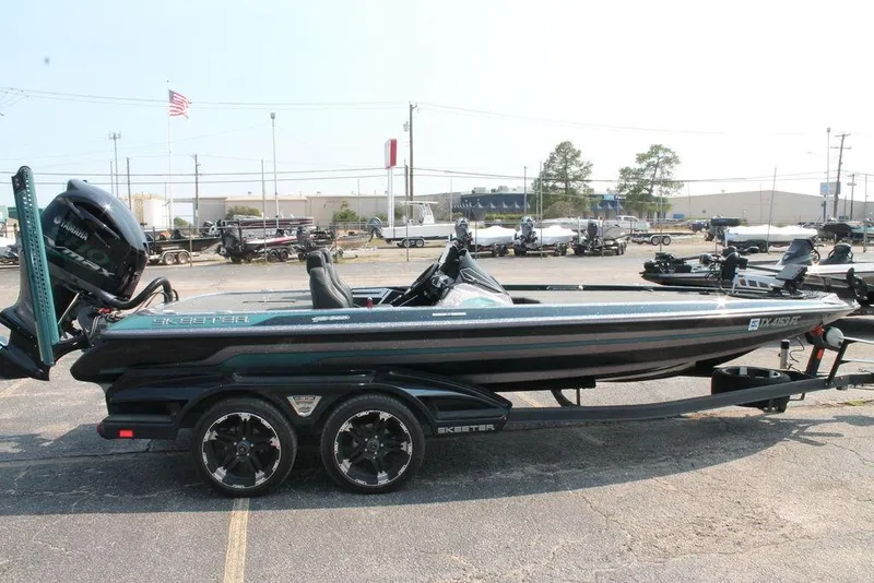 Slide: The Image of 2019 Skeeter FX21 LE boat on trailer, parked outdoors with Yamaha engine. - 6