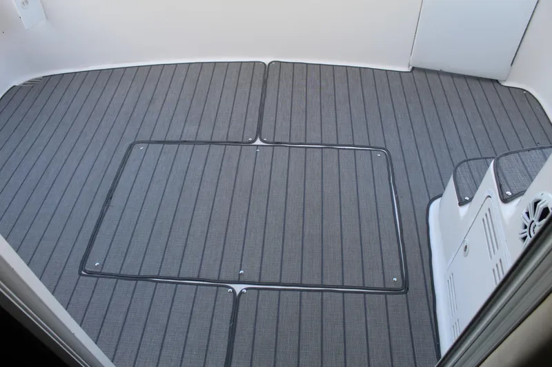 Slide: The Image of 1997 Sea Ray 400 Sedan Bridge interior with sleek, modern flooring design. - 10