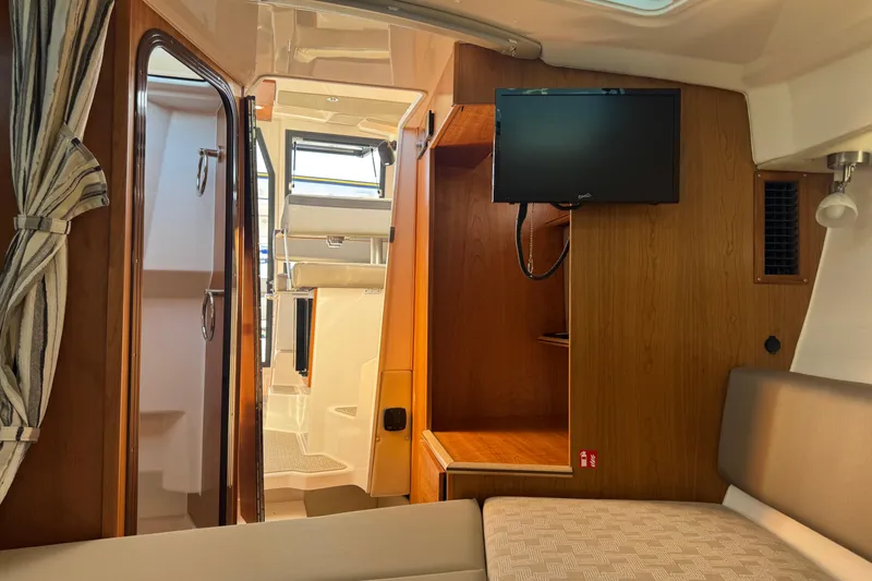 Slide: The Image of Interior of 2026 Cutwater C-288 Coupe with TV and seating area. - 16