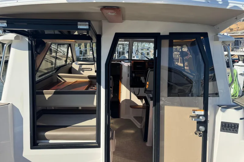 Slide: The Image of 2026 Cutwater C-288 Coupe interior view with seating and navigation area. - 8