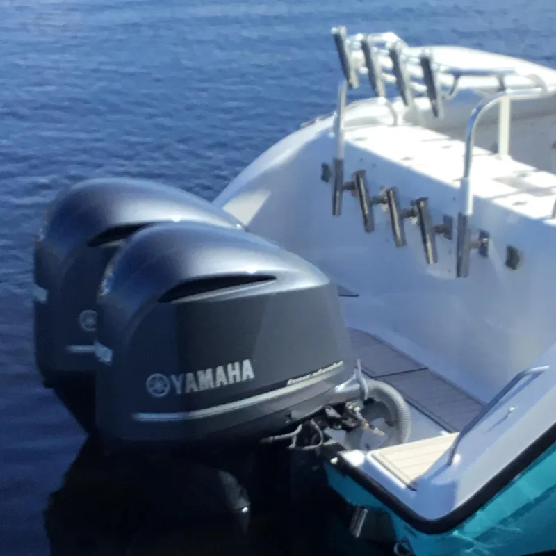 Slide: The Image of Century 3200 Center Console 2004 with dual Yamaha outboard motors on water. - 10