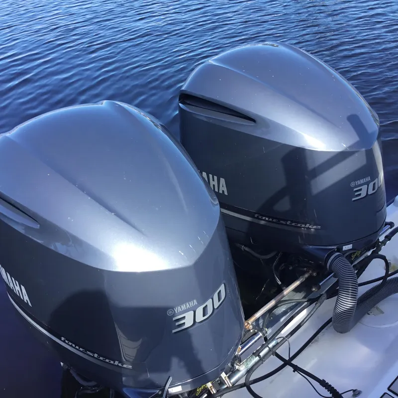 Slide: The Image of Twin Yamaha 300 outboard engines on a 2004 Century 3200 Center Console boat. - 11