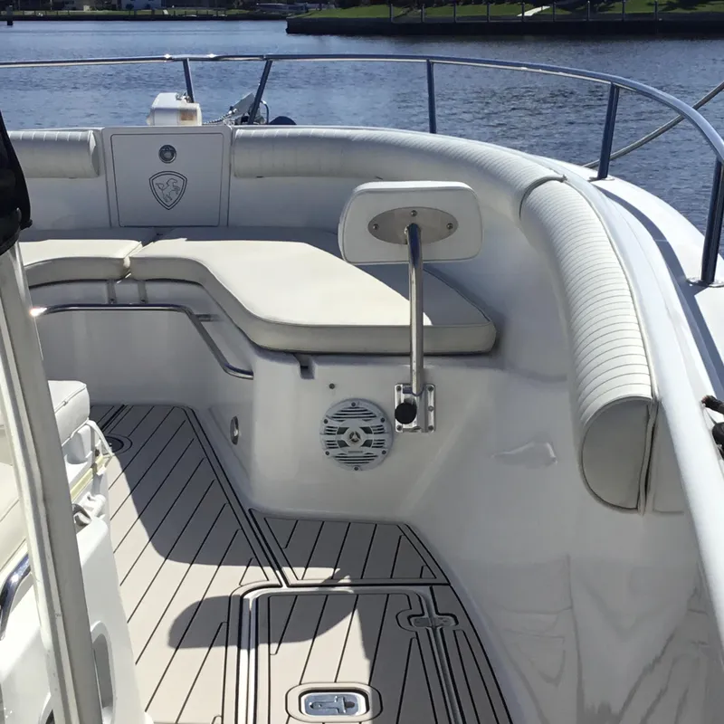 Slide: The Image of 2004 Century 3200 Center Console boat interior with cushioned seating and sleek design. - 17