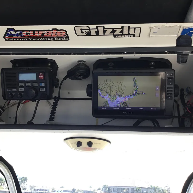 Slide: The Image of Boat dashboard with Garmin GPS and Icom radio, Century 3200 Center Console, 2004 model. - 34