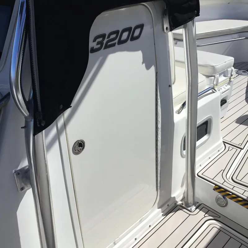 Slide: The Image of 2004 Century 3200 Center Console boat interior with sleek design and modern features. - 36