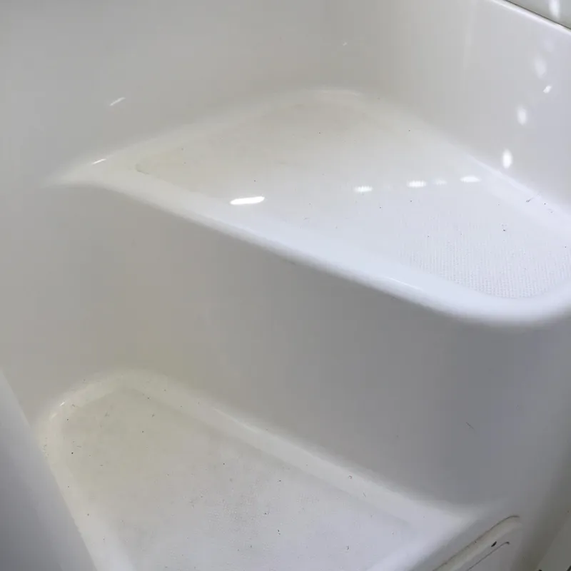 Slide: The Image of White interior step of 2004 Century 3200 Center Console boat. - 37