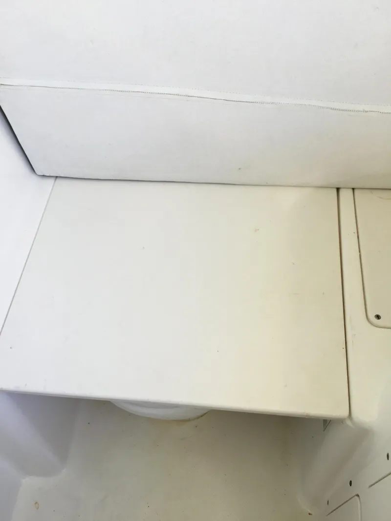 Slide: The Image of White seating area on a 2004 Century 3200 Center Console boat. - 38