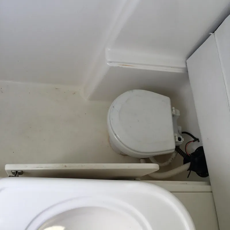 Slide: The Image of 2004 Century 3200 Center Console boat toilet interior view. - 39