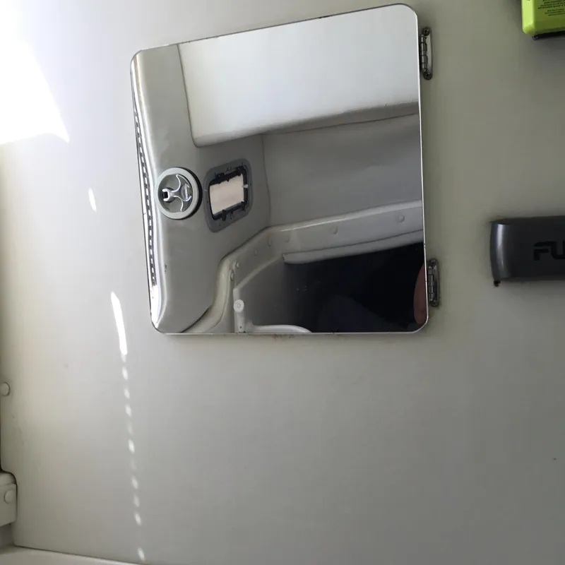 Slide: The Image of 2004 Century 3200 Center Console interior with mirror and control panel. - 44