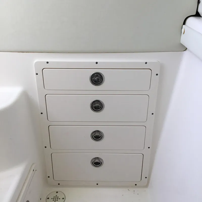 Slide: The Image of 2004 Century 3200 Center Console boat storage drawers. - 45