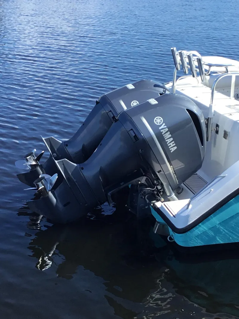Slide: The Image of Twin Yamaha outboard motors on a 2004 Century 3200 Center Console boat. - 9