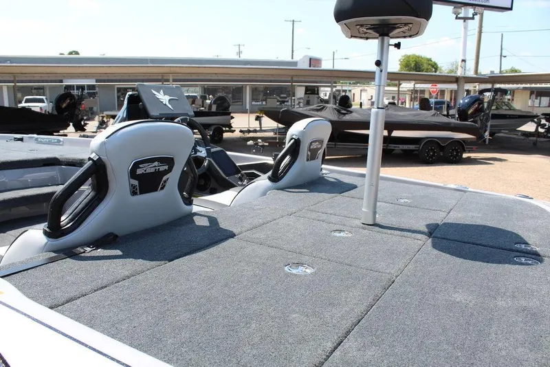 Slide: The Image of 2026 Skeeter FXR20 FLEX boat interior with modern seating and dashboard controls. - 10