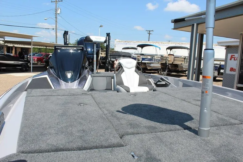 Slide: The Image of 2026 Skeeter FXR20 FLEX boat with advanced navigation equipment on deck. - 13