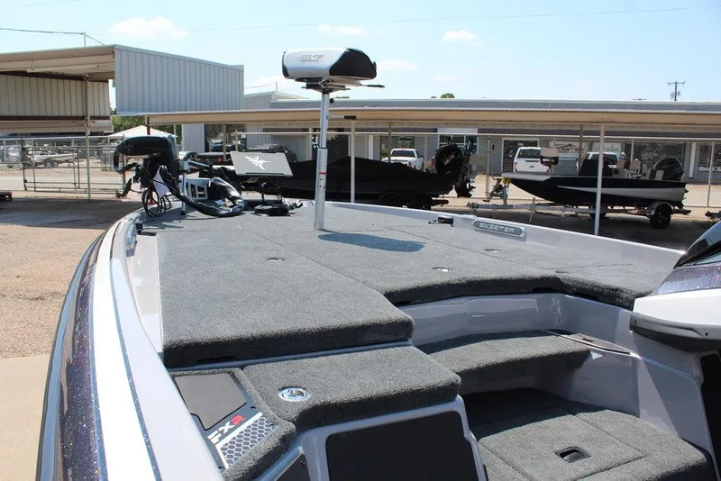 Slide: The Image of 2026 Skeeter FXR20 FLEX boat interior with seating and console details. - 16