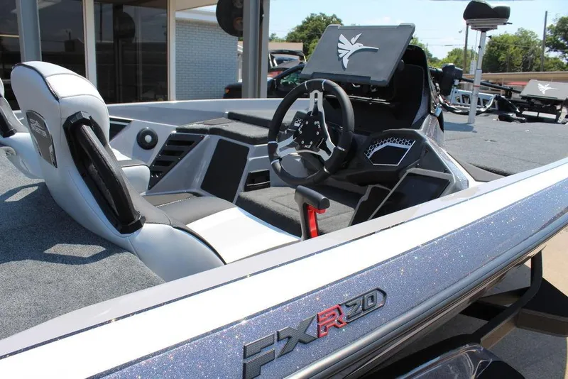 Slide: The Image of 2026 Skeeter FXR20 FLEX boat interior with sleek seats and modern steering wheel. - 18