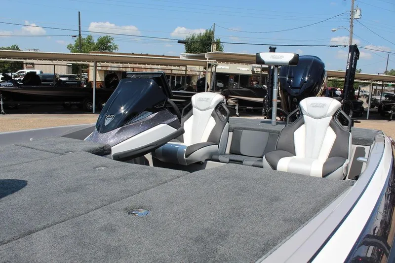 Slide: The Image of 2026 Skeeter FXR20 FLEX boat on trailer, showcasing sleek design and black wheels. - 6