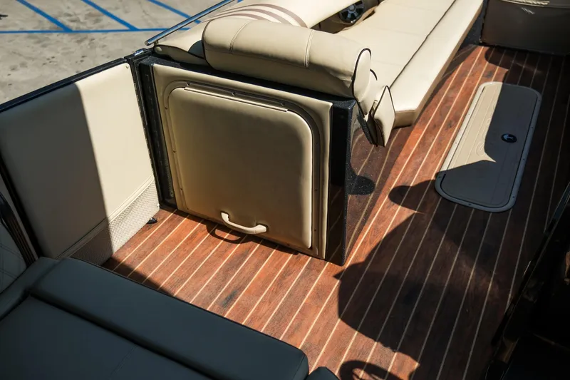 Slide: The Image of 2018 Crest Savannah 250 SLS interior with wood flooring and beige seating. - 14