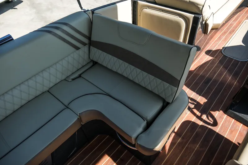 Slide: The Image of 2018 Crest Savannah 250 SLS boat interior with luxurious seating and wood flooring. - 17