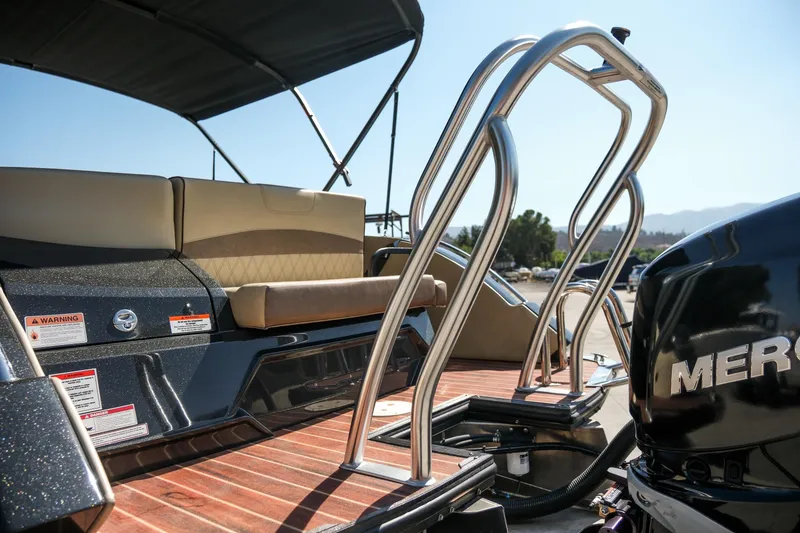 Slide: The Image of 2018 Crest Savannah 250 SLS boat with ladder and Mercury engine, featuring comfortable seating. - 19