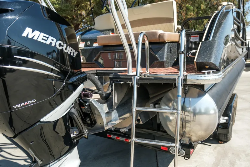 Slide: The Image of 2018 Crest Savannah 250 SLS pontoon boat with Mercury Verado engine and swim ladder. - 20