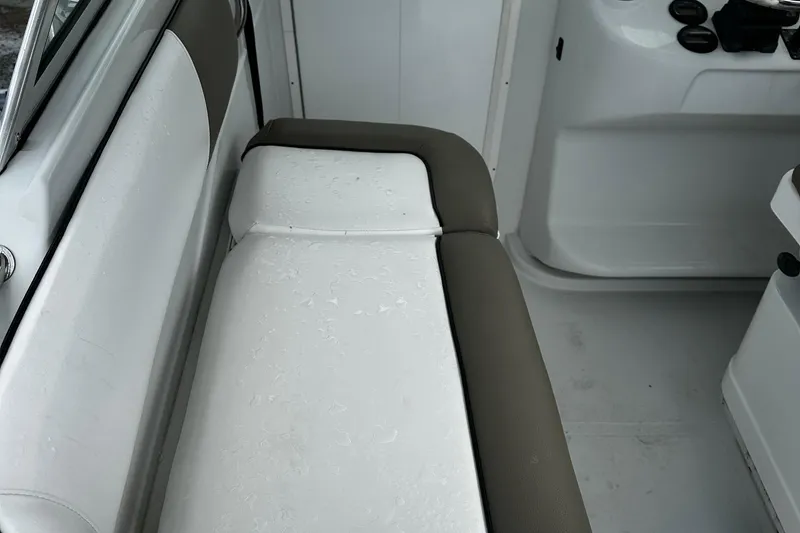 Slide: The Image of Interior of 2006 Glacier Bay 2670 boat with compact toilet and wooden cabinet. - 16
